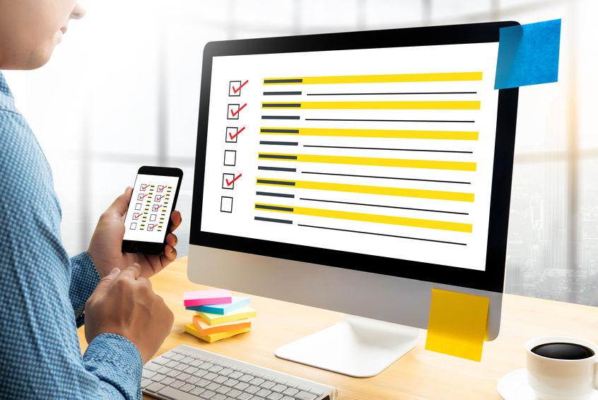 PIcture showing a person in front of a computer screen that is showing a survey graphic to depict surveying stakeholders which is needed for technology needs assessment in elderly care organizations